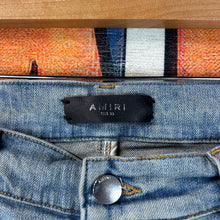 Load image into Gallery viewer, Amiri MX1 Ripped Skinny Jeans Size 33”
